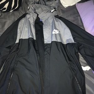 Grey and black nike windbreaker with hood